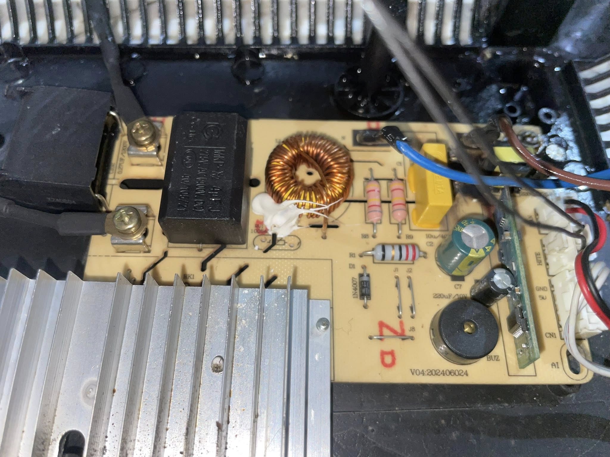 Refrigerator repair in Santa Cruz — technician checking a fridge that stopped cooling