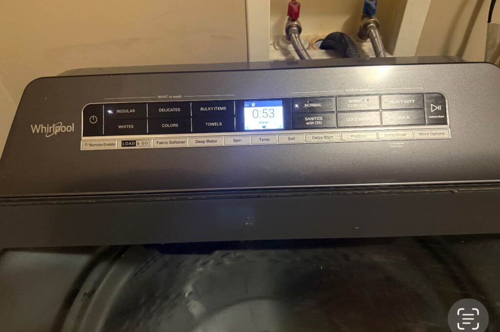 Close-up of a washing machine control panel displaying settings, an area that might need troubleshooting or repair.