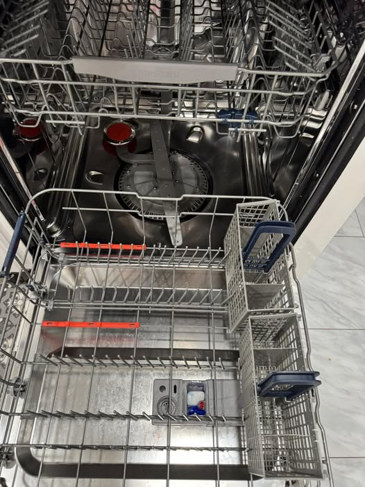 Dishwasher repair in Santa Cruz, CA — open dishwasher being diagnosed by a technician